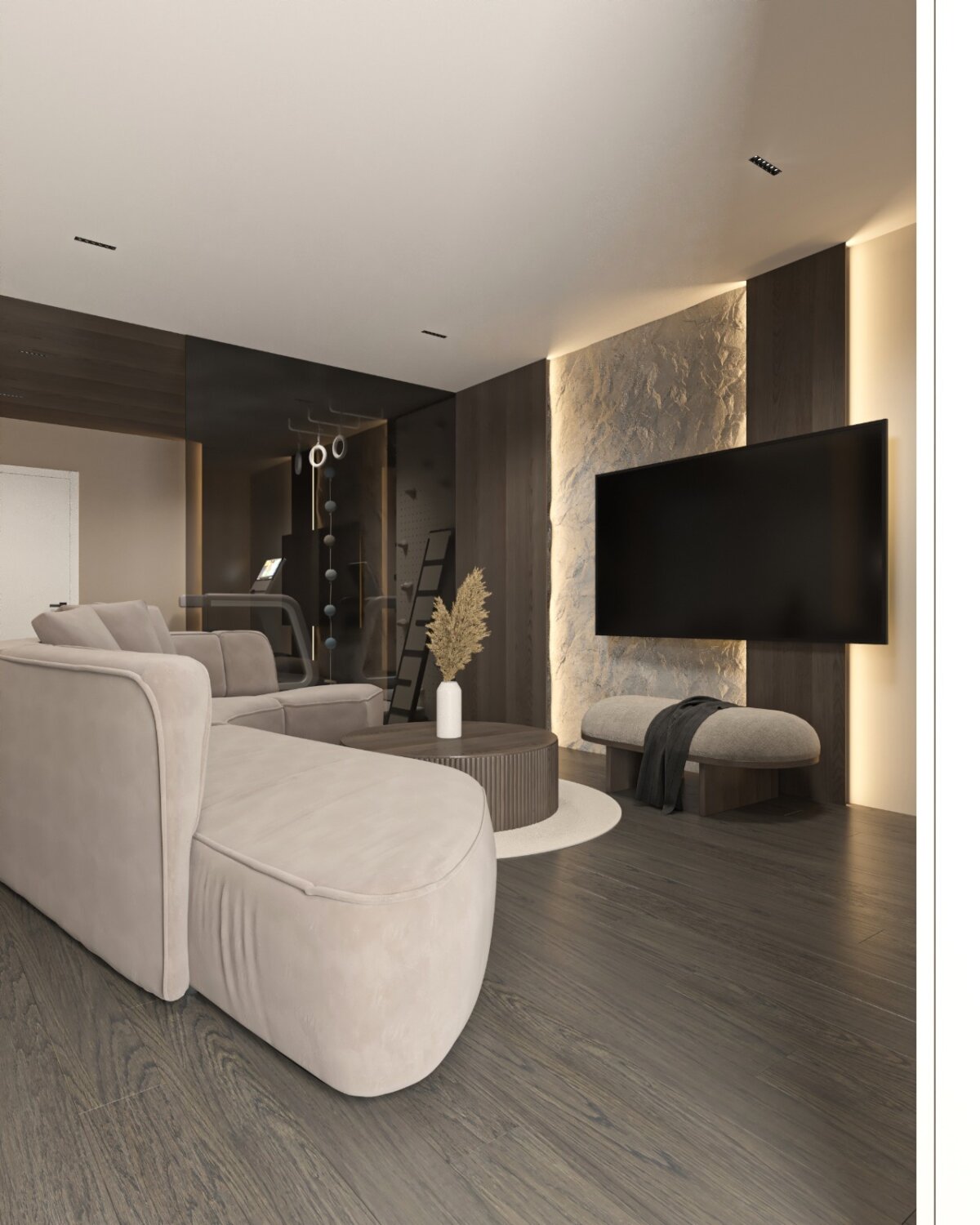 Loungebereich des Hobbyraums mit Wandfernseher, Sofa und dunklem Eichenboden